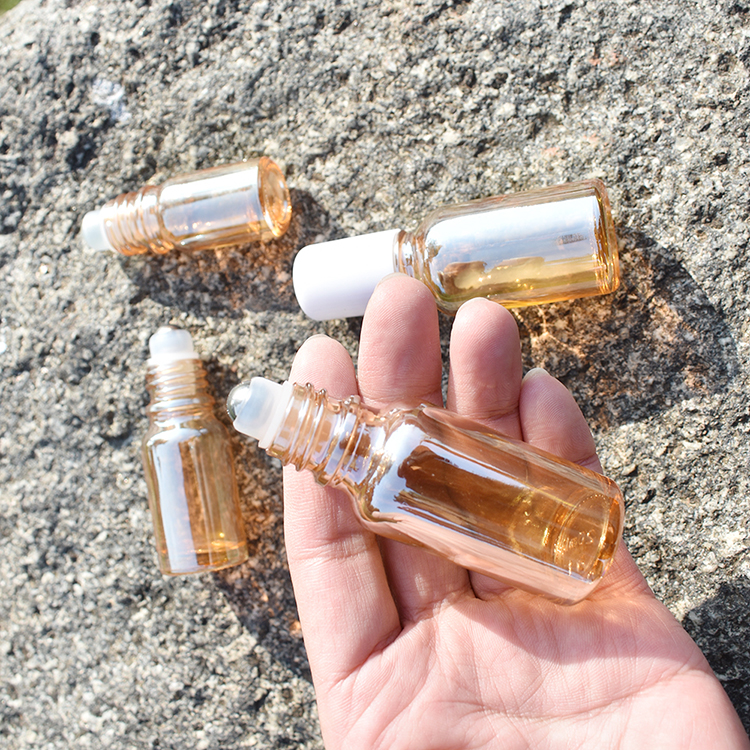 Free shipping Exquisite 10ml 20ml 30ml Amber Golden Glass Essential Oil Roll On Bottles With White Plastic Cap