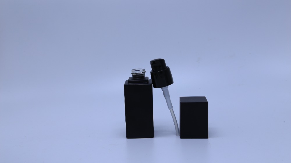 Frosted black glass bottle with pump for cosmetic