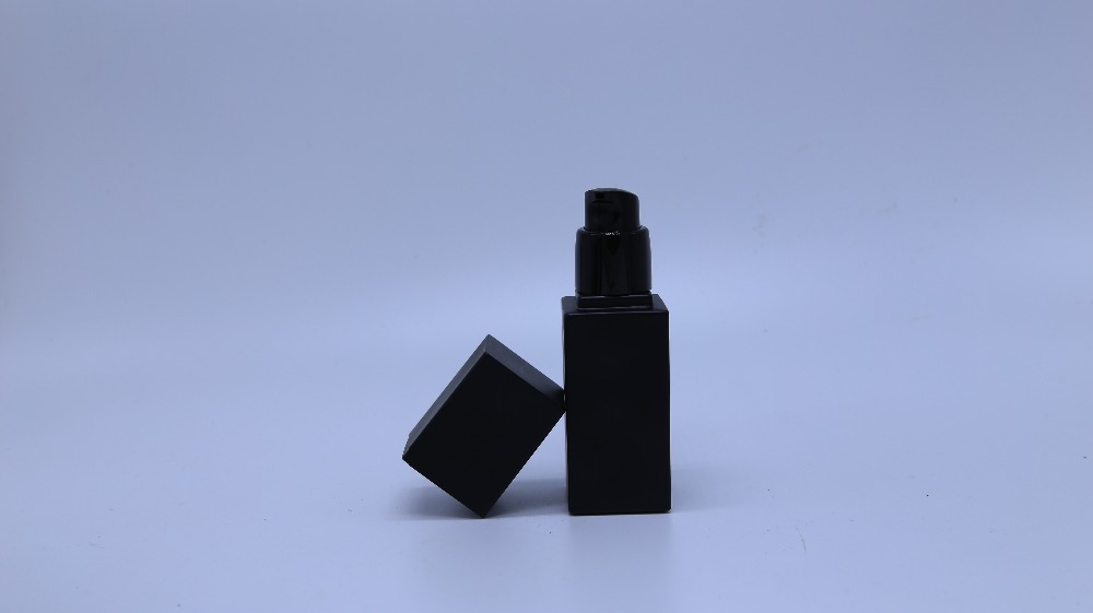 Frosted black glass bottle with pump for cosmetic
