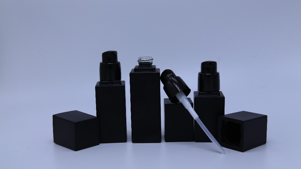 Frosted black glass bottle with pump for cosmetic