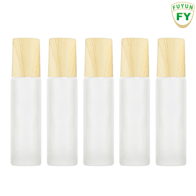 Fuyun Small quantity 10ml blue/amber/black/clear/pink bamboo cap essential oil roller glass bottle