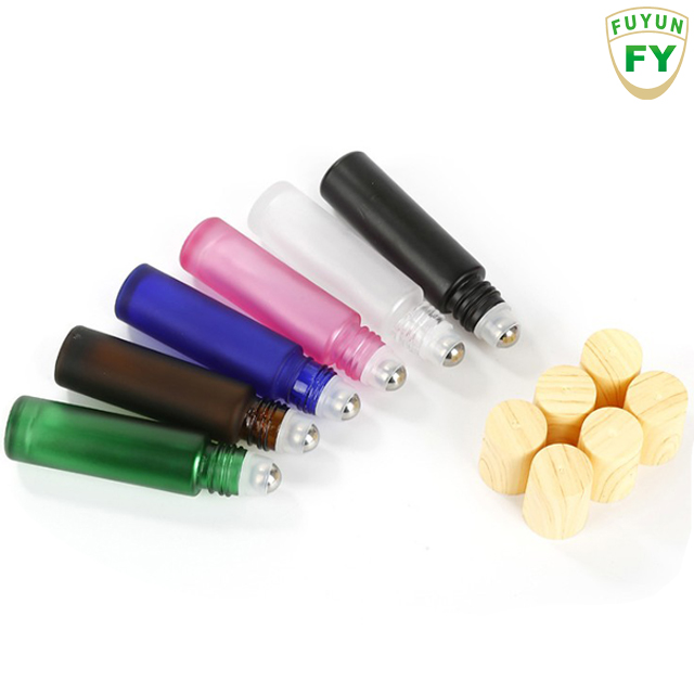 Fuyun Small quantity 10ml blue/amber/black/clear/pink bamboo cap essential oil roller glass bottle