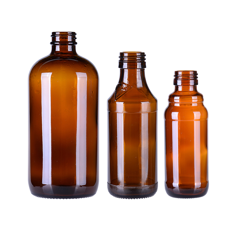 Glass amber pharmaceutical bottle with lids
