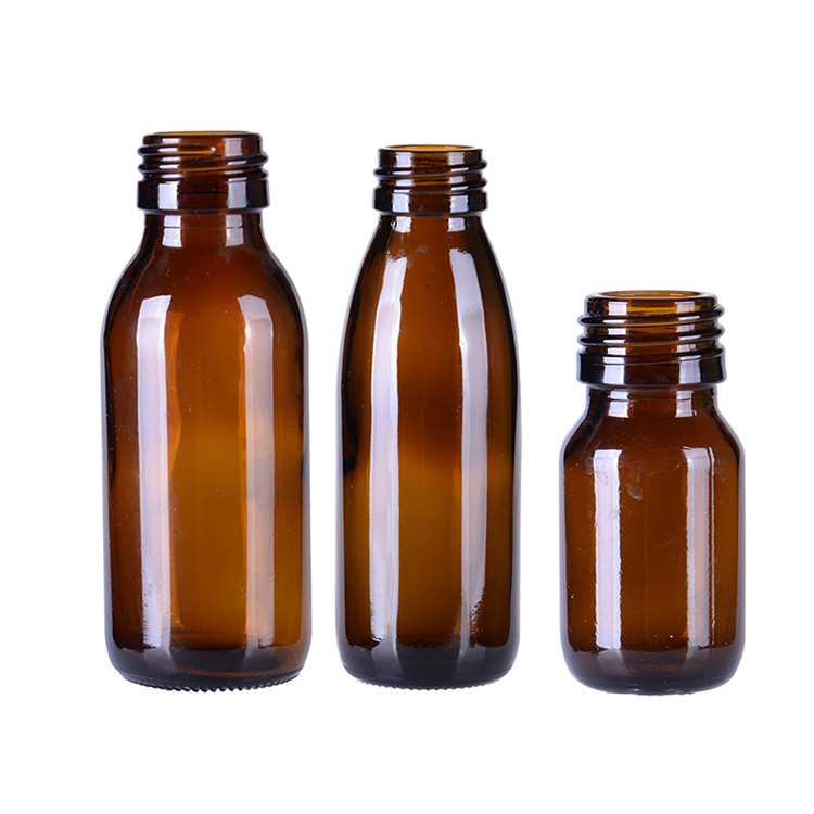 Glass amber pharmaceutical bottle with lids