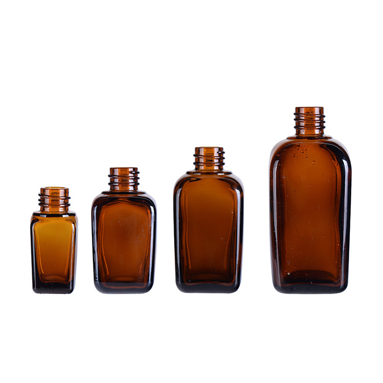 Glass amber pharmaceutical bottle with lids