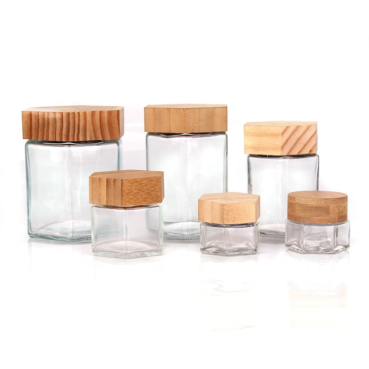Glass container jar for cosmetic honey jam with bamboo wooden lid