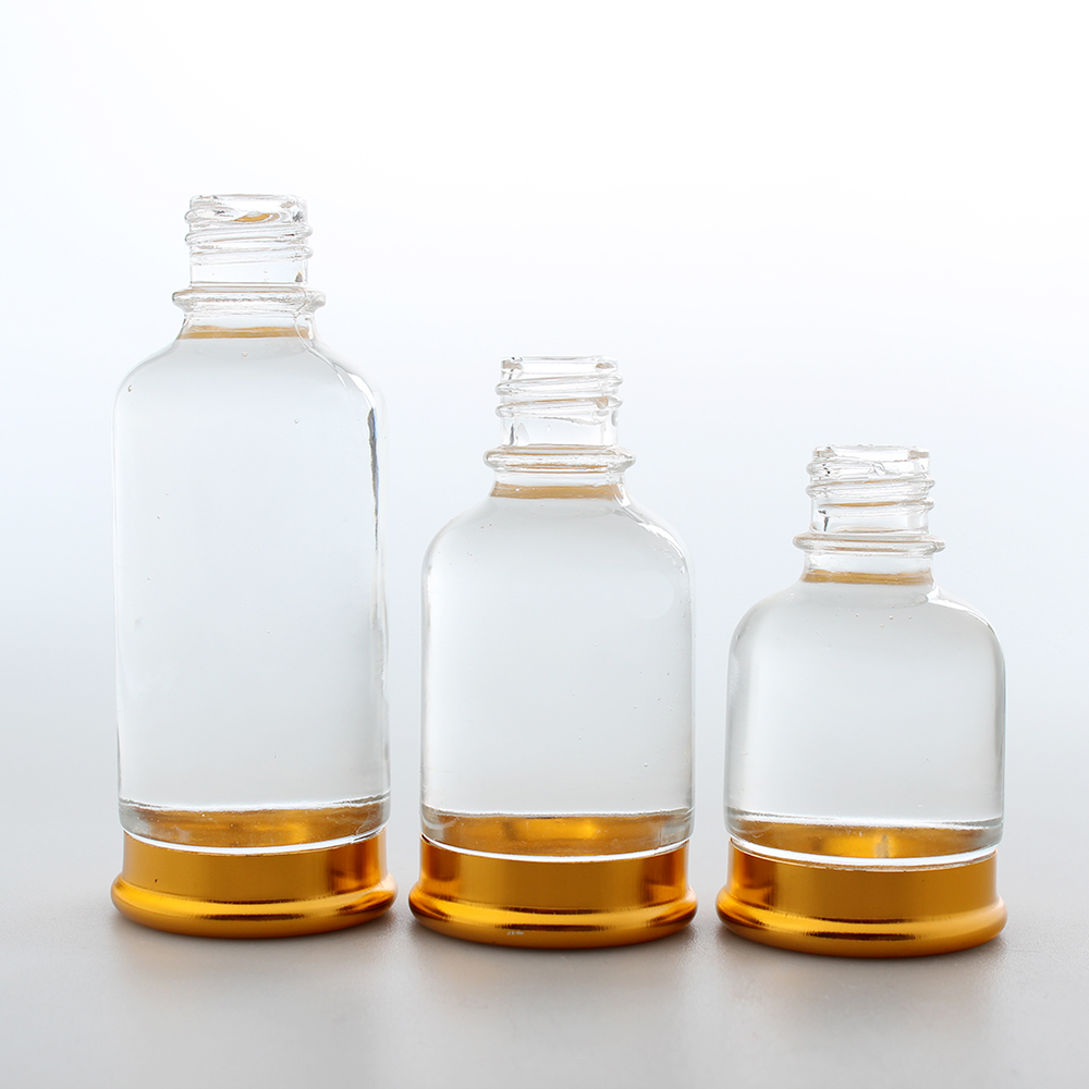 Glass essential oil dropper bottle with gold basket dropper