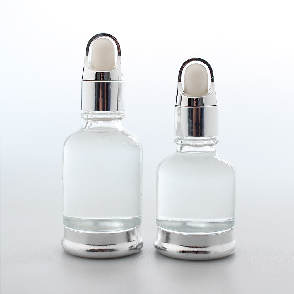 Glass essential oil dropper bottle with gold basket dropper
