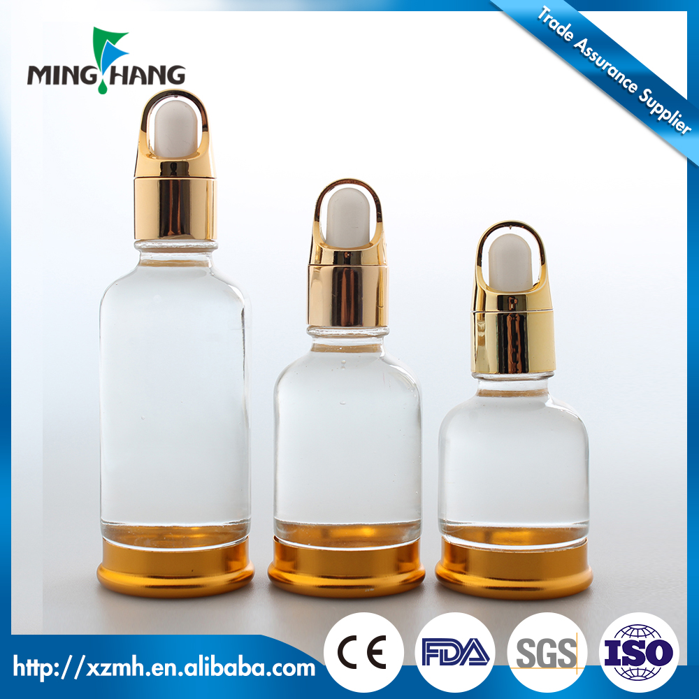 Glass essential oil dropper bottle with gold basket dropper