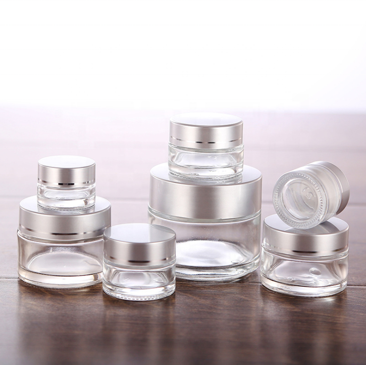 Good quality cosmetic packaging 50g glass jar 50 ml frosted clear cosmetic container glass bottle jar with matt silver lid