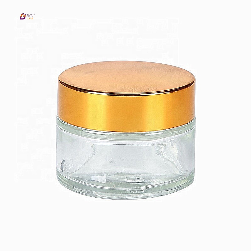 Good quality high-end cute cosmetic jars clear round glass jar with gold lids