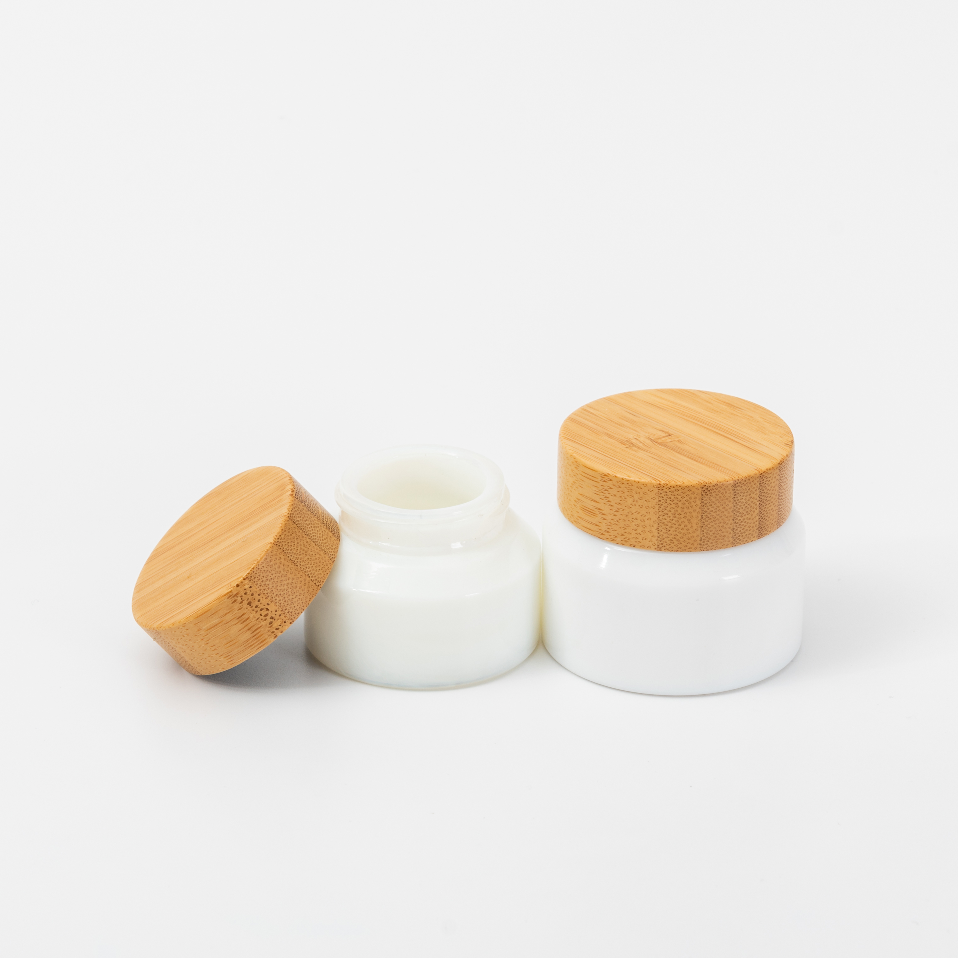Good selling 30g 50g 30ml 50ml 100ml opal white glass cosmetic bamboo bottle and jar glass bamboo lid bottle