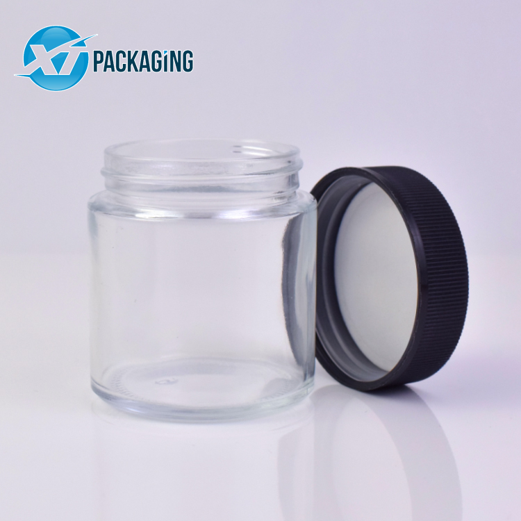 HOT 1oz 2oz 3oz 4oz Wholesale customized high quality small round straight sided clear glass jars with plastic CR lid