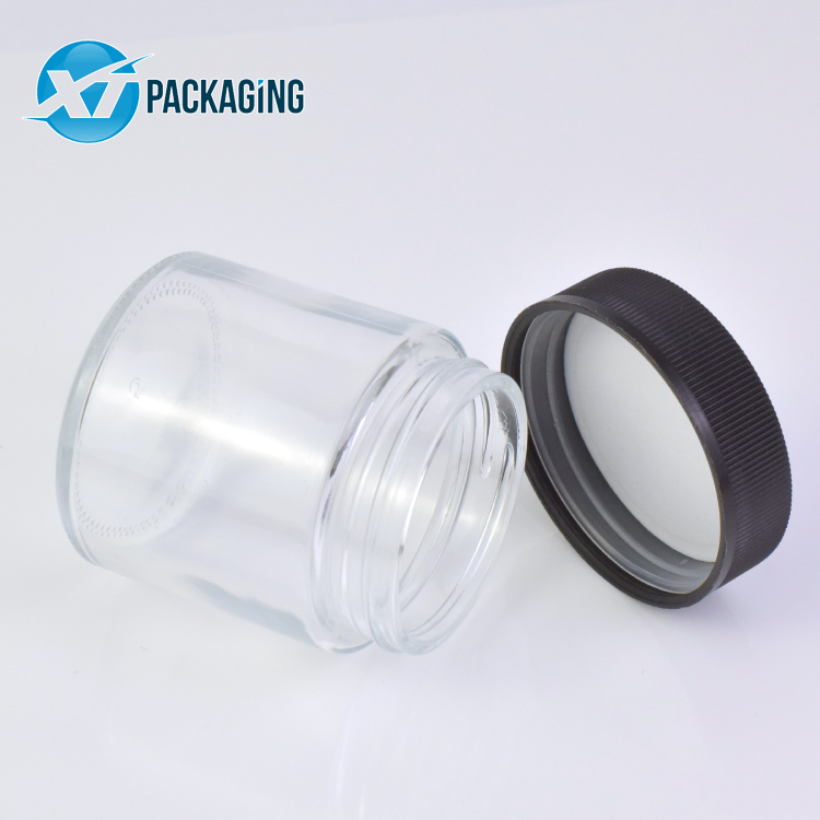 HOT 1oz 2oz 3oz 4oz Wholesale customized high quality small round straight sided clear glass jars with plastic CR lid