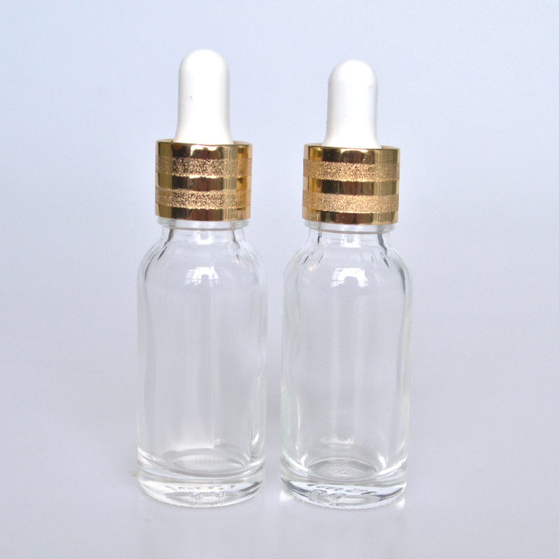 HOT sale luxury flat shoulder Cosmetics 30ml 50ml 60ml 100ml clear essential oil glass dropper bottle with gold cap