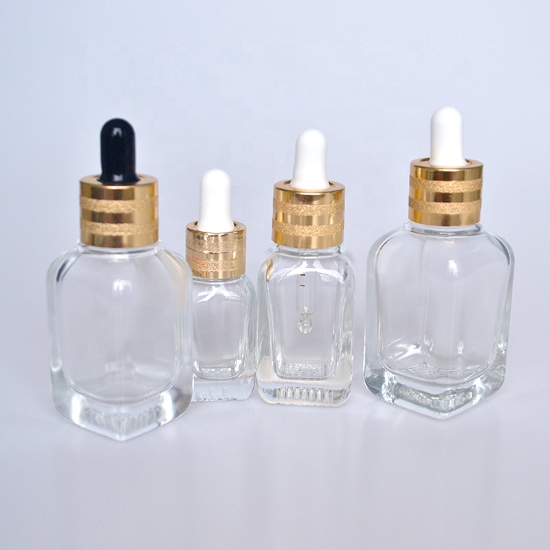 HOT sale luxury flat shoulder Cosmetics 30ml 50ml 60ml 100ml clear essential oil glass dropper bottle with gold cap