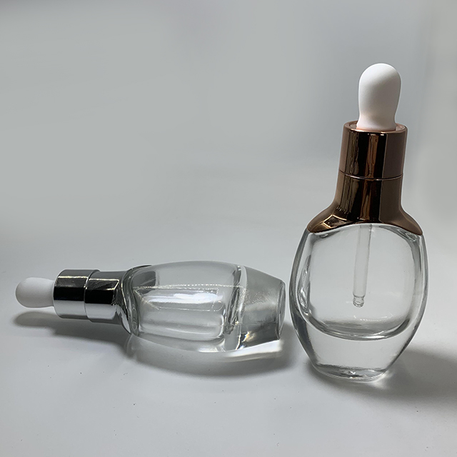 Hengjian 30ml cosmetic essential oil clear flat shape glass dropper bottle with silver gold cap for massage oil