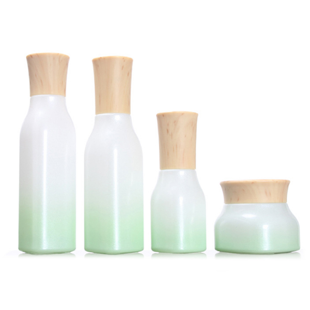 Hengjian 50g graduated green white glass for cosmetic packaging skin care face eye cream jar with plastic wood pattern cap