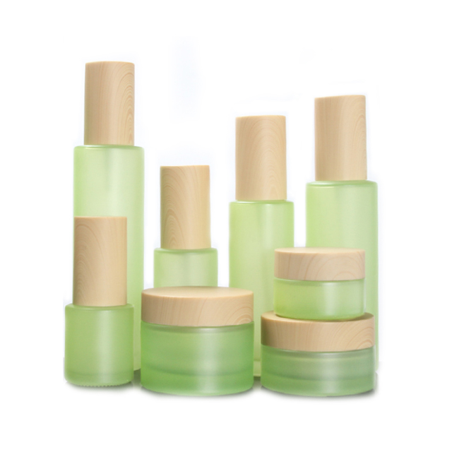 Hengjian have stock 50g 30g 20g 10g 5g matt green glass cosmetics jar with plastic cap in bamboo printing color for cream