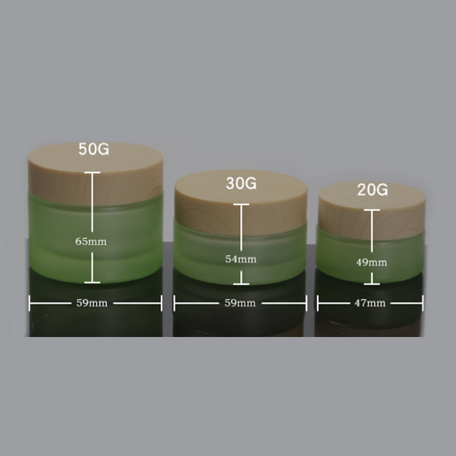 Hengjian have stock 50g 30g 20g 10g 5g matt green glass cosmetics jar with plastic cap in bamboo printing color for cream