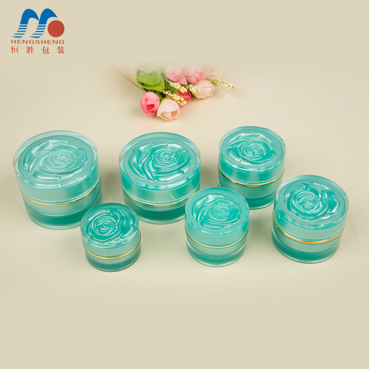 Hengsheng manufacturer  hot sale cylinder green color acrylic cream jar with flower decorative lid 5g 10g 15g 25g 30g 50g