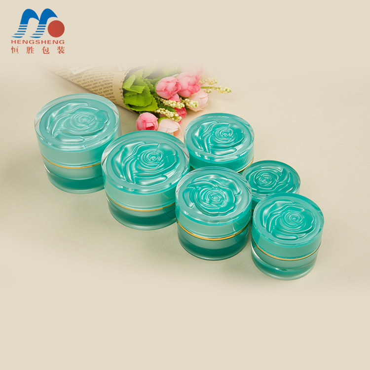 Hengsheng manufacturer hot sale cylinder green color acrylic cream jar with flower decorative lid 5g 10g 15g 25g 30g 50g