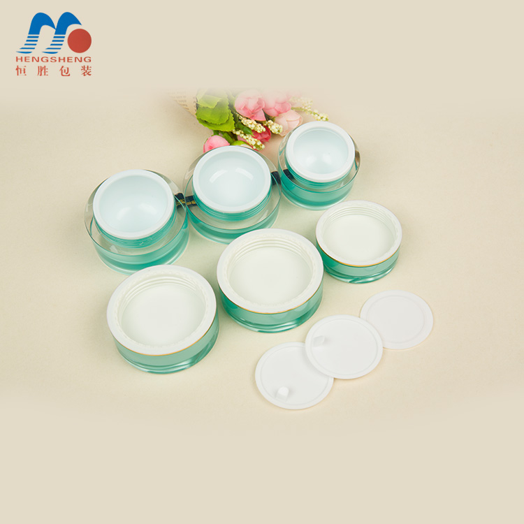 Hengsheng manufacturer hot sale cylinder green color acrylic cream jar with flower decorative lid 5g 10g 15g 25g 30g 50g