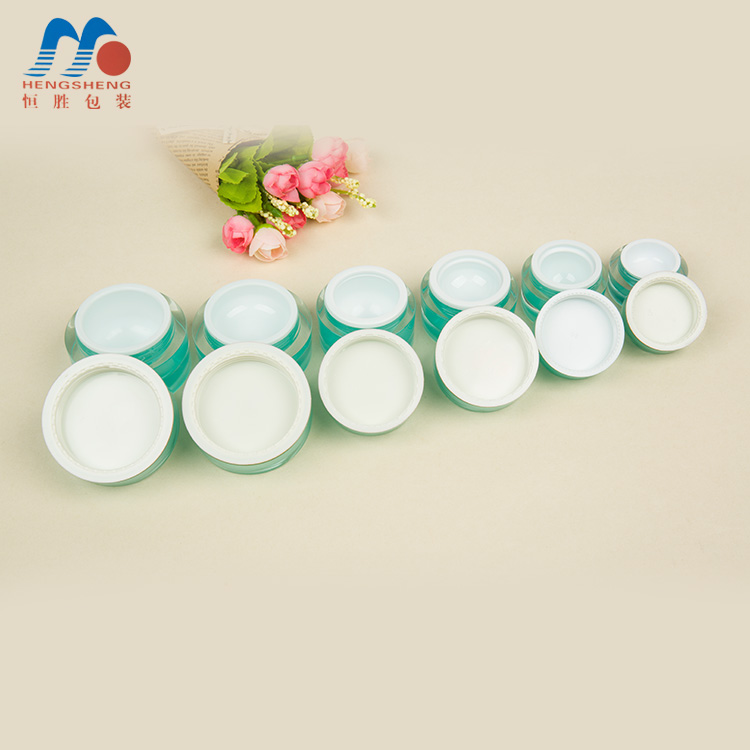 Hengsheng manufacturer hot sale cylinder green color acrylic cream jar with flower decorative lid 5g 10g 15g 25g 30g 50g