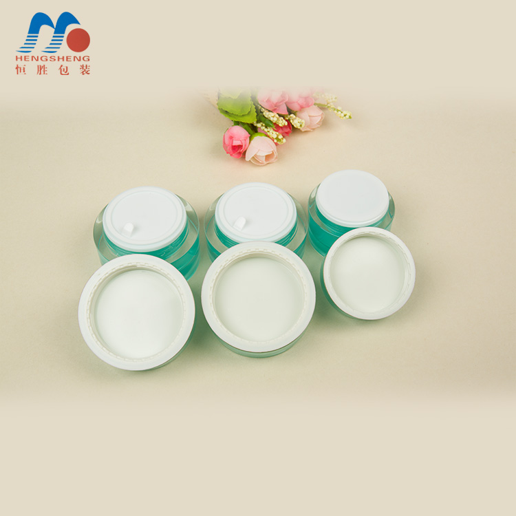 Hengsheng manufacturer hot sale cylinder green color acrylic cream jar with flower decorative lid 5g 10g 15g 25g 30g 50g