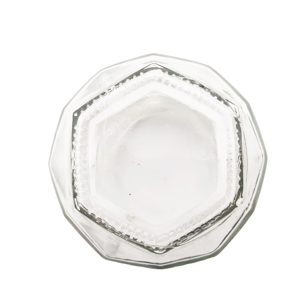 Hexagon glass storage honey jar with screw metal lid and irregular surface