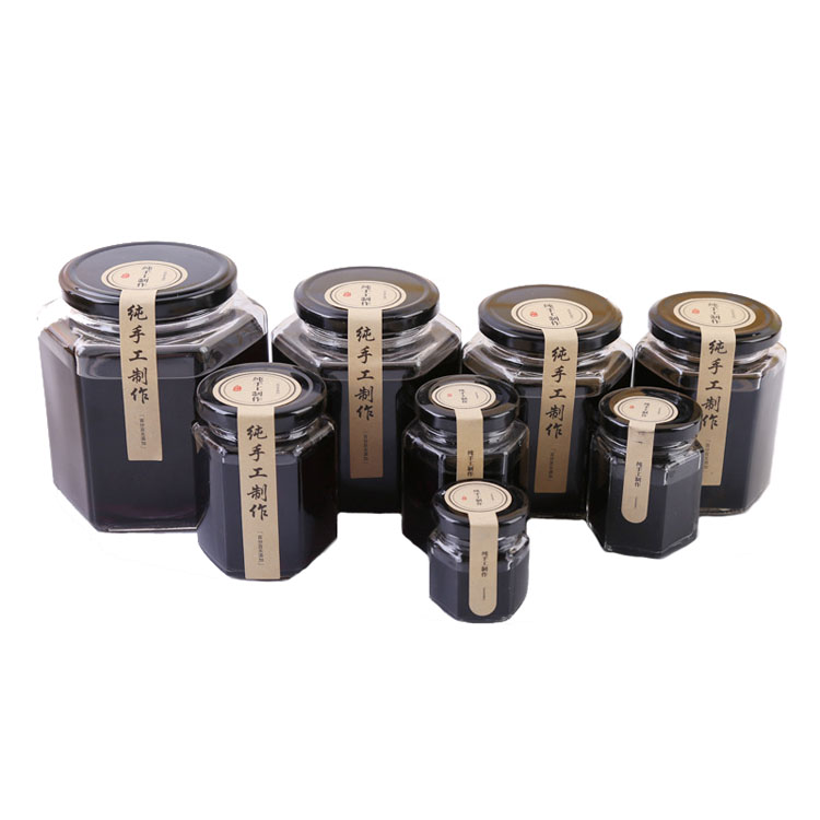 High Quality 6oz 180ml storage bottles Hexagon shape honey jam glass jar with mental black lids