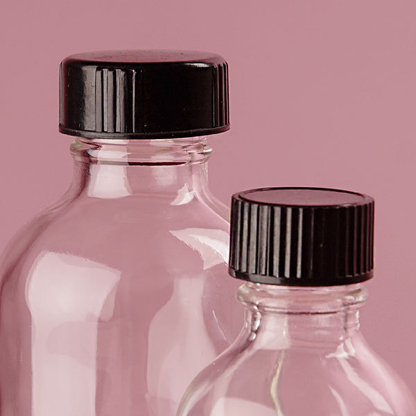 High Quality Boston Round Glass Bottle With Black Phenolic Cone Line Caps