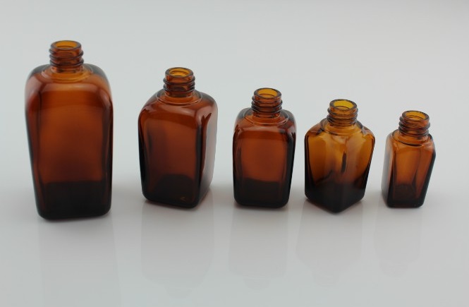 High Quality amber rectangular bottle with black spray pumps for skincare cosmetic packaging glass bottle