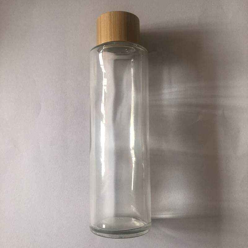 High grade 100ml 120ml 150ml clear / frosted glass cosmetic toner bottle with screw bamboo cap
