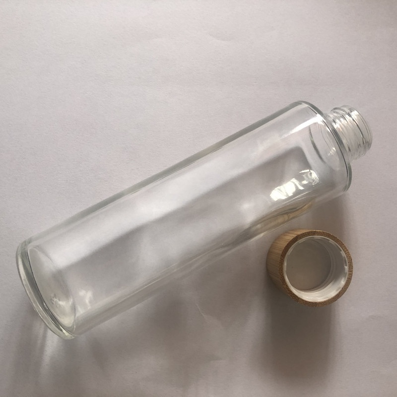 High grade 100ml 120ml 150ml clear / frosted glass cosmetic toner bottle with screw bamboo cap