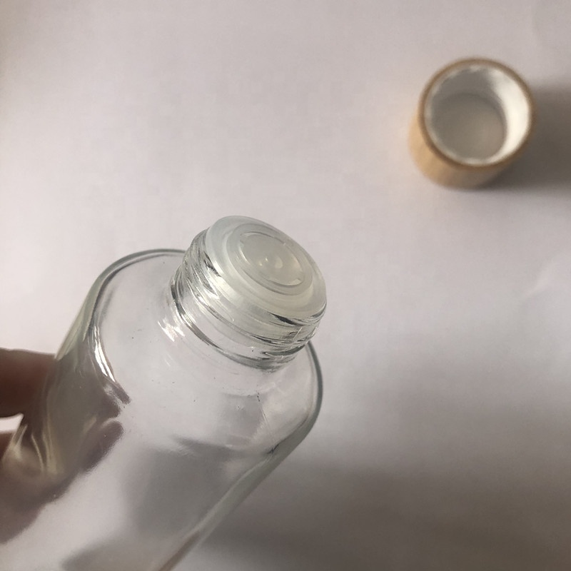 High grade 100ml 120ml 150ml clear / frosted glass cosmetic toner bottle with screw bamboo cap