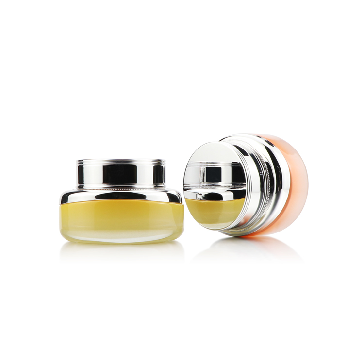 High grade 50ml empty oval yellow cosmetic packaging face cream glass jar with silver plastic cap for personal care