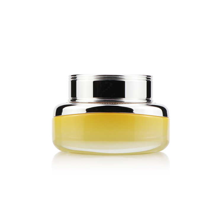 High grade 50ml empty oval yellow cosmetic packaging face cream glass jar with silver plastic cap for personal care