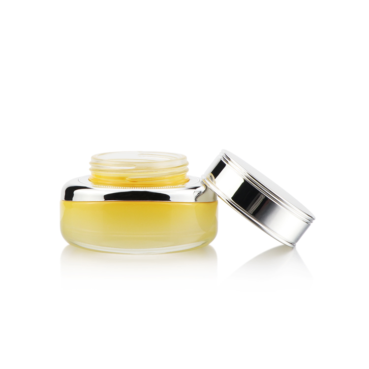 High grade 50ml empty oval yellow cosmetic packaging face cream glass jar with silver plastic cap for personal care