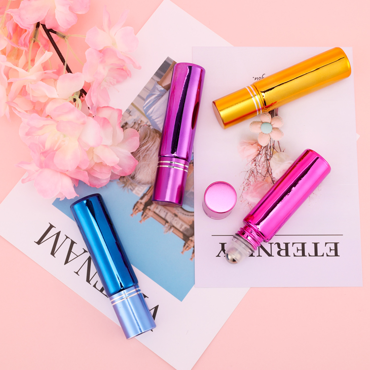 High grade 5ml 10 ml 15ml pink empty round eye cream roll on perfume glass bottle with roller ball lids