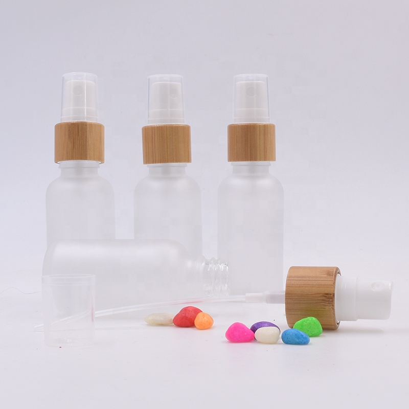 High quality 1 oz 1/2 oz 1 3oz 2 oz 4 oz frosted bamboo cap empty cream boston round pump spray glass bottles for cosmetics