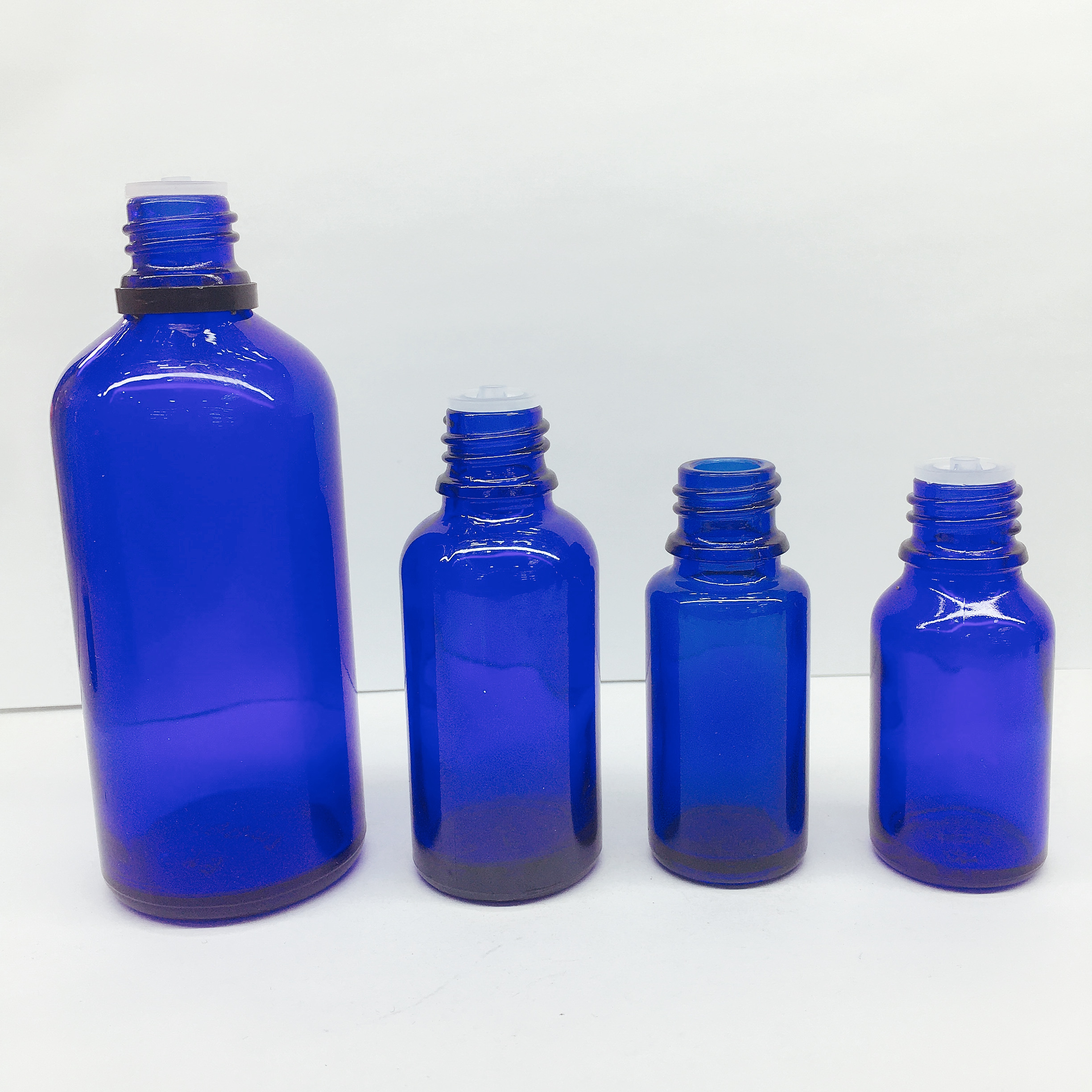 High quality blue essential oil bottle with black cap Complete specifications