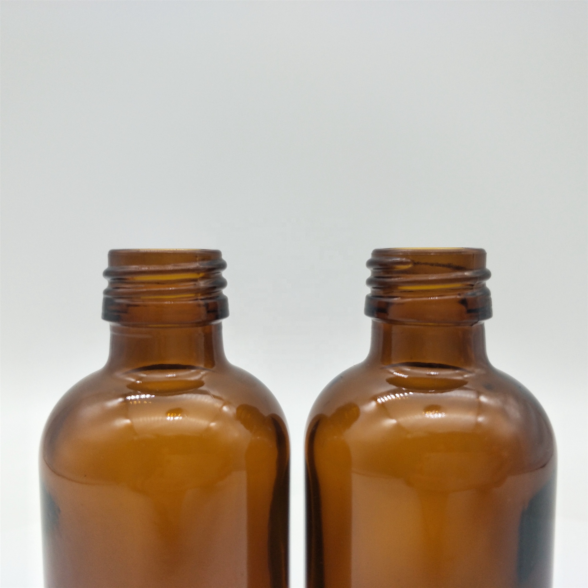 High quality boston round amber glass bottle tamper proof cap with aluminum ROPP caps