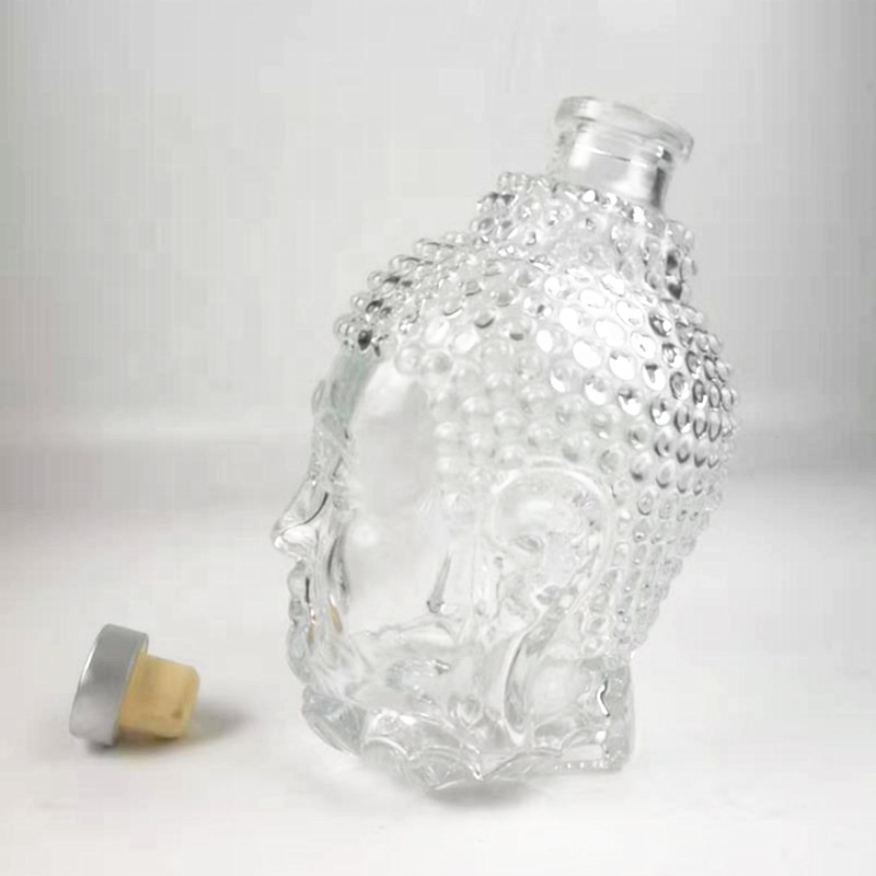 High quality buddha head shape vodka / wine / tequila / gin glass bottle 750ml with cork stopper lid