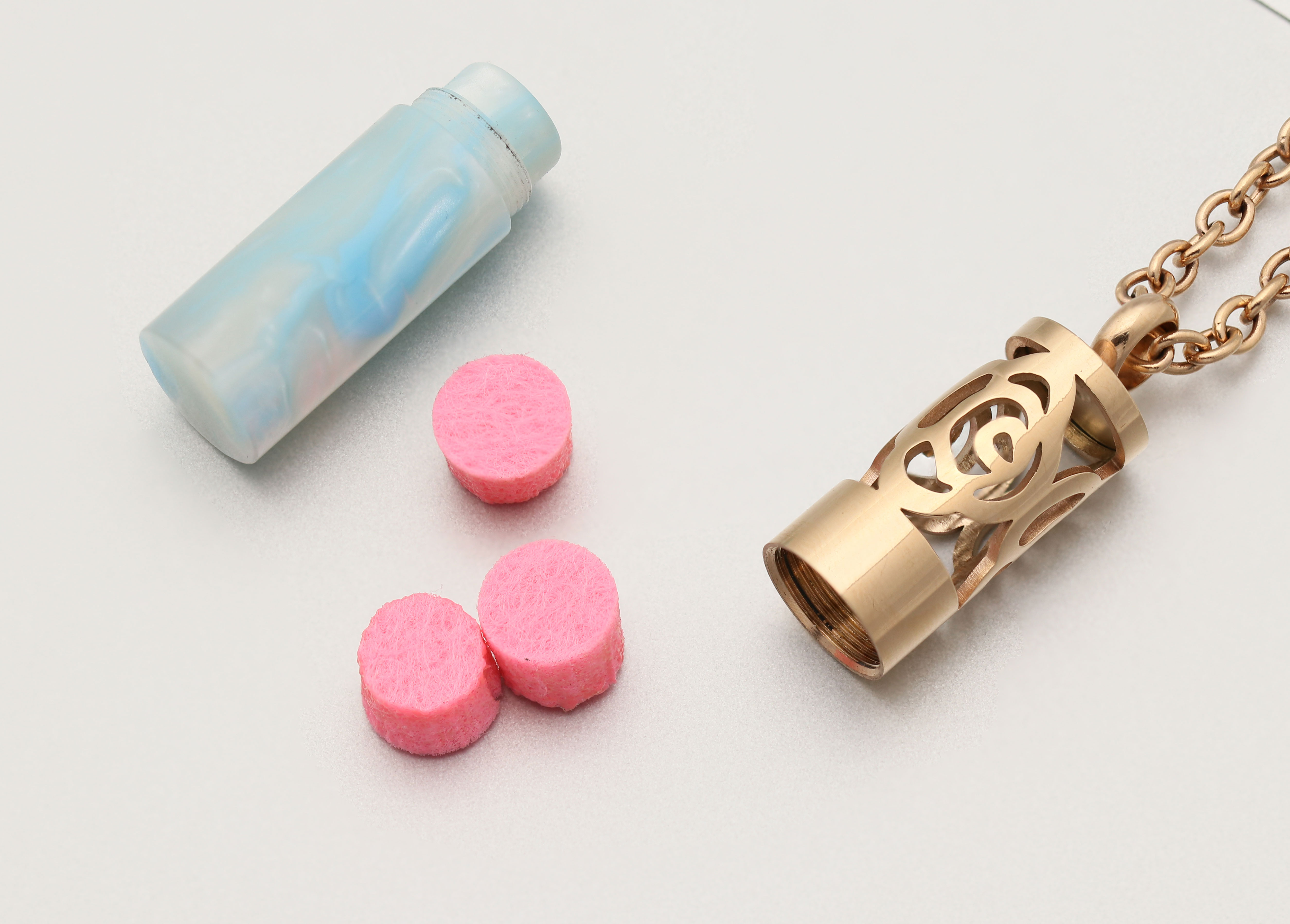 High quality coloured resin has chain perfume bottles.