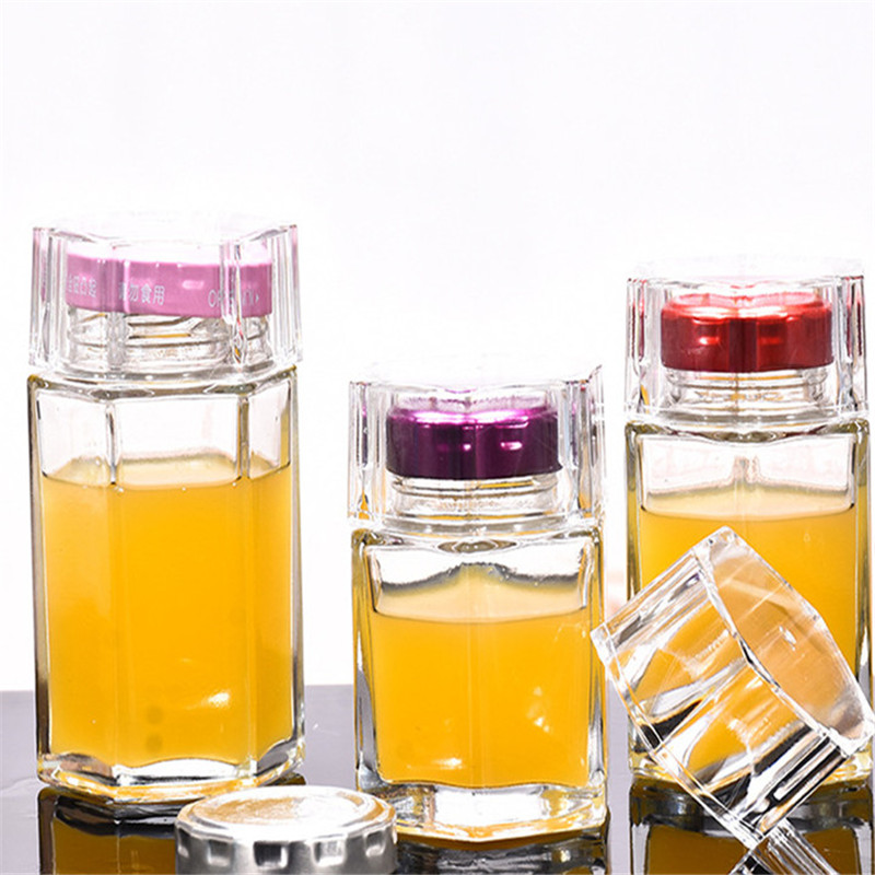 High quality hexagonal glass jar storage bottle honey jar with lid