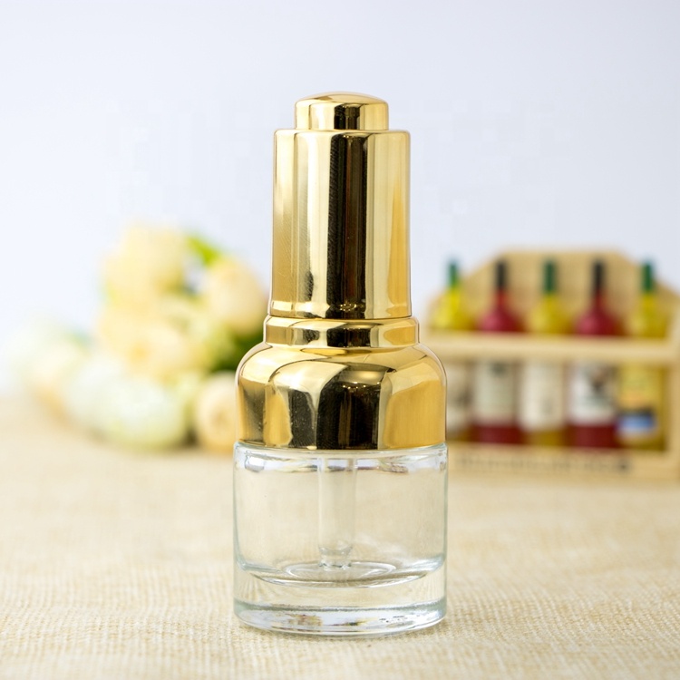 High quality oval metal shoulder dropper bottle cosmetic clear gradient glass bottle pump with gold dropper