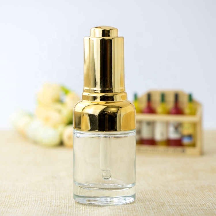 High quality oval metal shoulder dropper bottle cosmetic clear gradient glass bottle pump with gold dropper