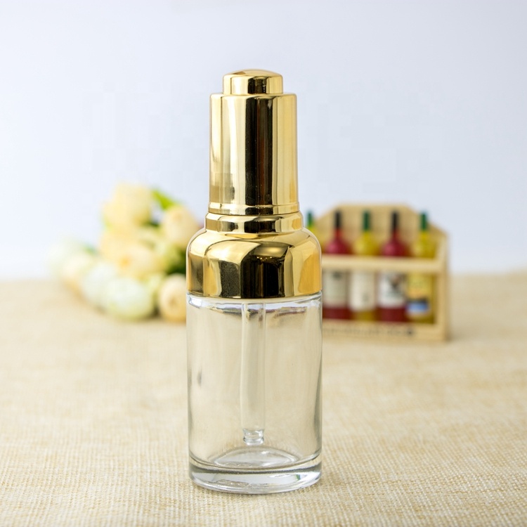 High quality oval metal shoulder dropper bottle cosmetic clear gradient glass bottle pump with gold dropper