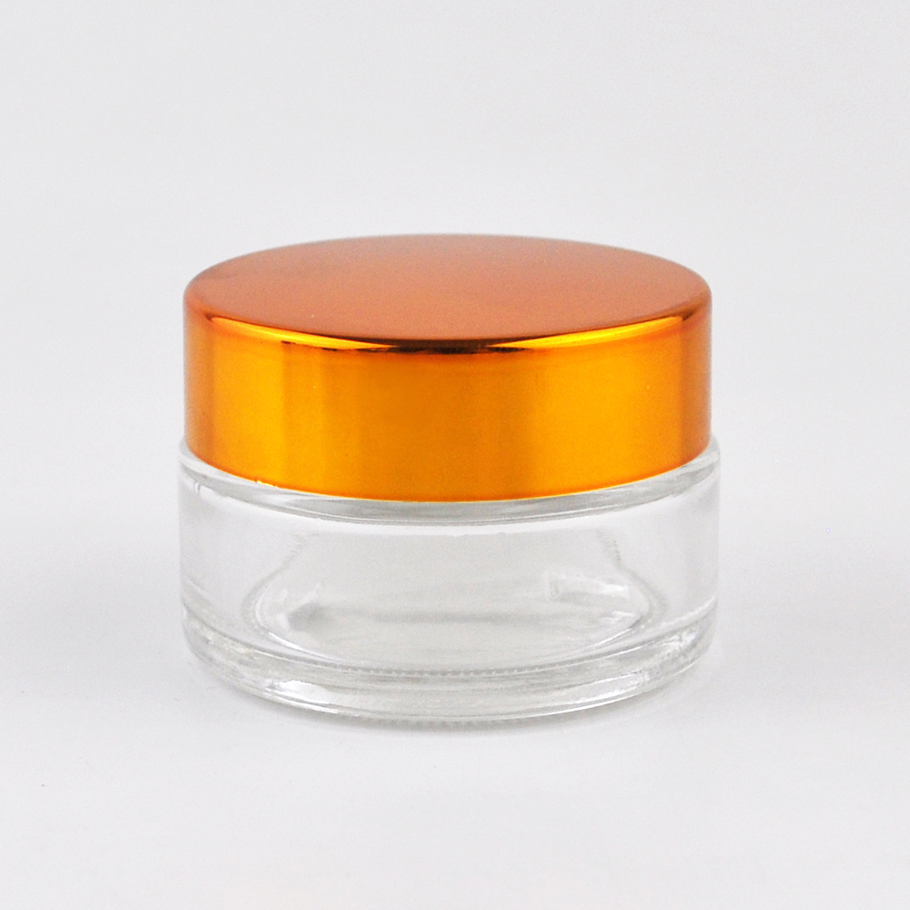 High quality round bottle clear glass jar with gold aluminum lid cosmetics bottle container